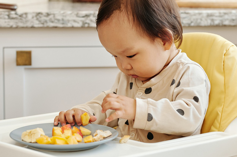 infant with food