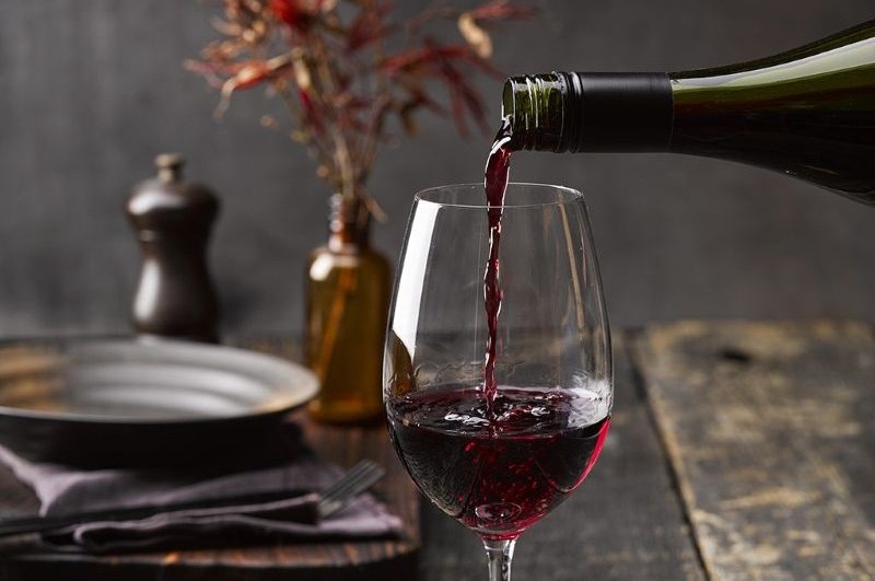 pouring pinot noir wine